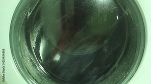 Close Up of the wash cycle of a high-efficiency front-loader washing machine