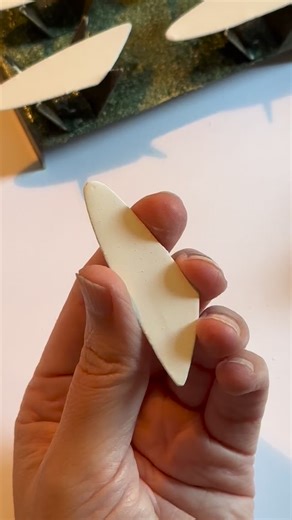 Sgraffito is the art of scratching through a layer of enamel to reveal the surface underneath. In this case, I’m creating a a hand drawn pattern inspired by layered chrysanthemum petals, revealing the bare copper underneath. When fired, the copper pattern turns black with oxidation while the white enamel will take on green, yellow, orange, red, and purple tones from the reaction between the copper and the titanium in the enamel through the heating process. Art meets science! | Annie Grimes Willi