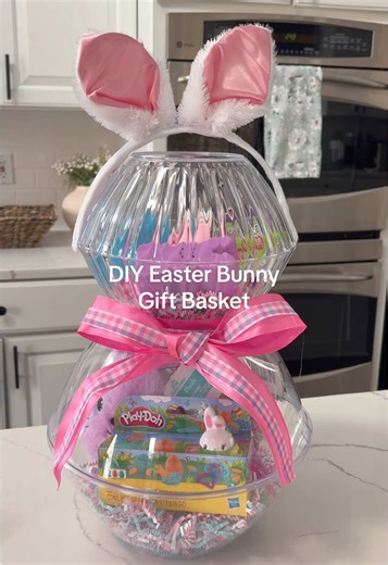 Dollar Tree DIY Easter Bunny gift basket 🐰💝🎀 This is a great idea for little kids for Easter 🐣 I made it toddler friendly for my nieces 👯‍♀️ I added crafts, kid friendly snacks, and hair accessories 🎀🐰 It’s so easy to put together and it’s budget friendly gift ideas 👏 see list below 👇 What you need: Dollar Tree items to make this bunny -two large plastic bowls -two small plastic bowls (matching colors with the larger ones ) -gift bag fillers 2x -large ribbon of choice -Bunny Ears from W