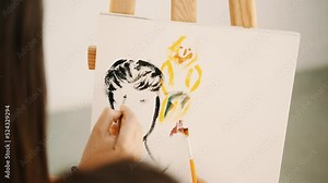 Drawing with two hands. Couple is drawing picture. Man and woman make strokes on canvas and depict person. Rest with art. People get to know each other while drawing. Hobby that calms and relaxes