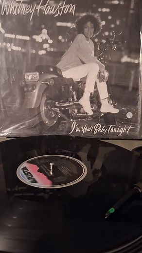 Classic Vinyl Record Player Showcasing Whitney Houston