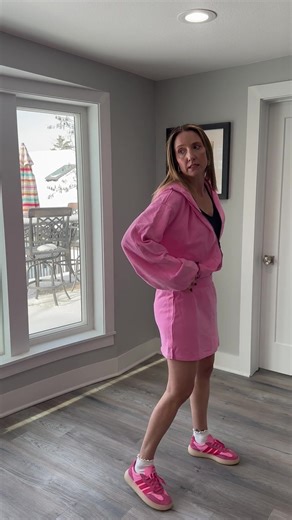 Cute pink tennis outfit, but big on me! Pink sets, ruffled socks, and zero time for average. 🎀🥂 The perfect uniform for a fresh, bold start to a lakeside Saturday. Snag the links for my favorite athletic sneakers and this cozy set at the link in my bio! ✨ #OOTD #PinkStyle @VICI #CasualSocial #ShopTheLook Bubblegum pink lounge set, pink zip-up hoodie, pink mini skirt, pink and red athletic sneakers, white ruffled crew socks, monochromatic pink outfit, feminine athletic wear, comfortable winter 