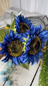 5.7K views · 84 reactions | In this KDS tutorial, we’re creating a stunning Blue Sunflower Lemon Arrangement that’s full of personality and perfect for summer! The combo of deep blue sunflowers with bright lemons gives this design a cheerful twist that’s fresh, fun, and totally eye-catching.  Grab the supply list and join us inside Kelea’s Design School to make your own: https://www.keleas.com/product/kds-tutorial-blue-sunflower-lemon-arrangement-supply-list/ | Kelea's | Facebook