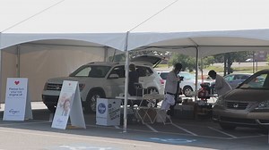 Kroger holds drive-thru flu shot clinic at War Memorial Stadium