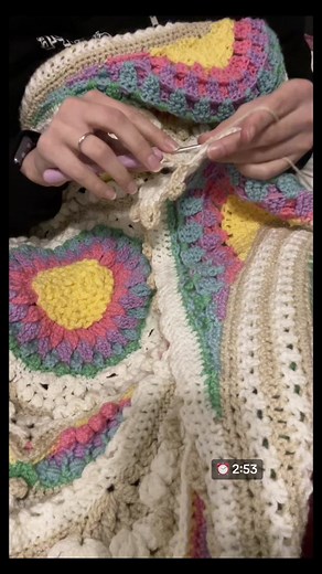 “Lovecraft” by Lydia Gates #SpokenWord #SlamPoetry #OriginalPoem #crochet Video length: 2 minutes 53 seconds. Video description: a flower motif blanket is draped across a person’s lap; their face is not visible. The colors used are yellow, pink, purple, blue, and green for the flowers and white and tan for the borders. Tan complexion hands wearing a plain silver wedding band are using a lavender handled crochet hook to work on a tan row of the blanket. #crocheting #CrochetersOfTikTok #ManicChang