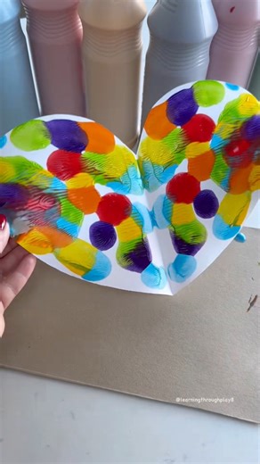 Symmetrical Heart Art 🩷🌈 A great way to explore symmetry. See if the children can identify any other shapes that would have lines of symmetry too. Give it a go! 🥰 #artforkids #ideasforkids #craftsforkids #valentinesdaygiftideas | Learning and Exploring Through Play