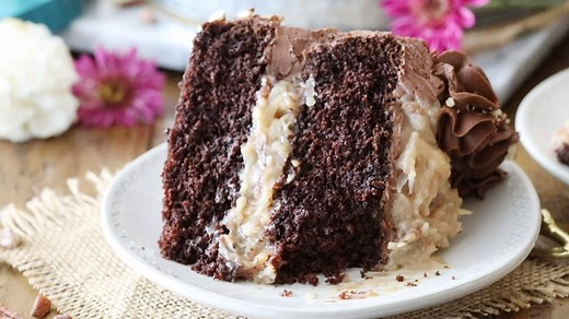 A decadent German Chocolate Cake Recipe, made with an extra moist and fudgy chocolate cake, a rich caramel/coconut frosting, and iced with a sweet and simple chocolate frosting. RECIPE: https://sugarspunrun.com/german-chocolate-cake/ | Sugar Spun Run