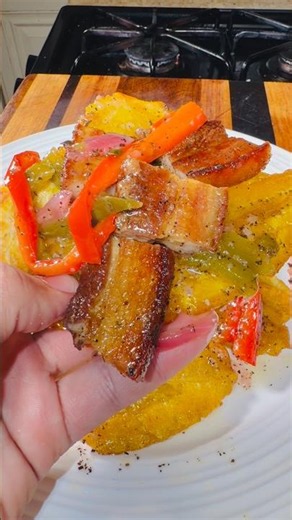 Pork cracklings with fried plantains in mojo sauce