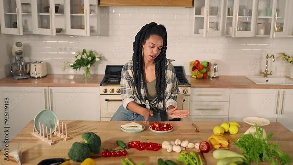 Vegetarian woman enjoying tasty vegetable salad in kitchen, portrait at home. Lunchtime and dinner, healthy nutrition for stay slender and beautiful, eating and losing weight, organic food from farm