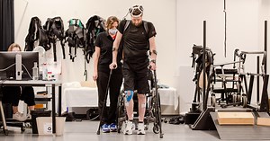 Brain implants help paralyzed man walk again