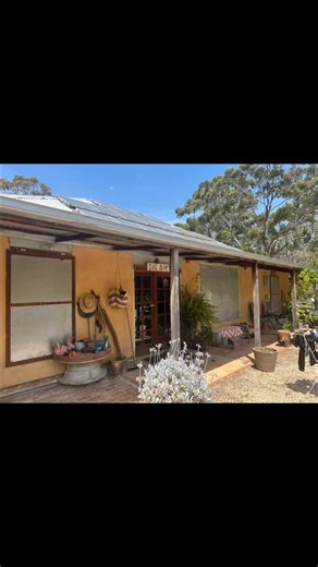 Thumbnail Green on Instagram: "41-43 Celsius here today with catastrophic conditions tomorrow but I did not build my house like fire isn’t a reality. To anyone rebuilding in California - earth render, brick paving, crushed stone path, steel fire shutters, underground oxygen intake, timber verandah (porch) made of Iron bark at great cost because it is rated to have flame against it for about 25 minutes and very difficult to burn. No windows to the dominant fire direction. Firefighting pump primed