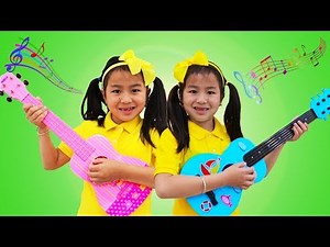 Jannie Plays Toy Guitar & Sings Kids Nursery Rhymes Songs at the Music Challenge Show