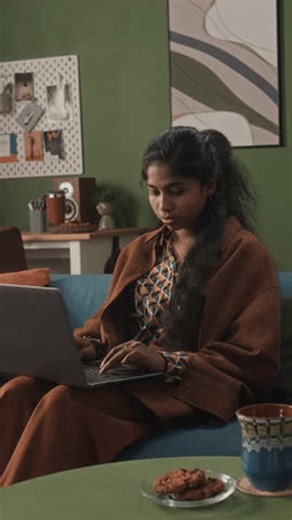 clip-3996455309-vertical-shot-south-asian-female-remote-worker