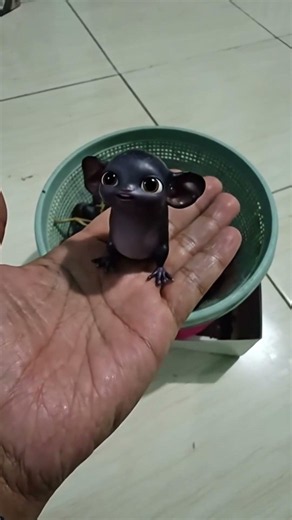 Mini Black Creatures Escaping From a Grape Bowl