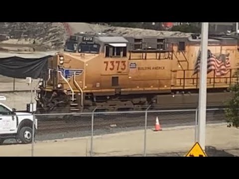UP 7373 leads an international / port stack train at Wilmington.