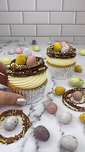 Chocolate sprinkle stacked nests 🍫🐥🪹 I was thinking of ways to make nests to sit top of my cupcakes that weren’t made from buttercream... and here we are 💁🏼‍♀️💗 You can’t go wrong when making these, as the messier the piping, the more real they look. It’s actually fun piping the circles of chocolate Add the sprinkles before chilling them in the fridge. When stacking the nests I added a small amount of melted chocolate between each layer to secure them 🍫🪹 Fill them with @cadburyaust mini 