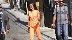 She means business! Alex Morgan takes the plunge in orange