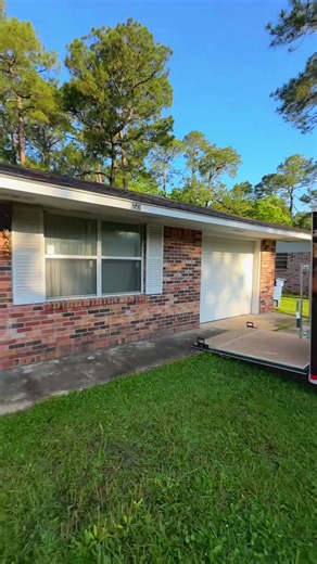 🔥 This is what the right exterior paint choices can do Custom wood shutters, lime-washed brick, and a bold Naval blue front door completely transformed this Ocean Springs home.#wackenhutpainting #transformation #viral #fyp #painting