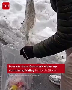 1.1M views · 20K reactions | Two tourists from #Denmark set an example as they were seen collecting waste material on the way to #YumthangValley in North #Sikkim. The act caught the attention of the locals and tourists, garnering appreciation. Watch | The Times of India | Facebook