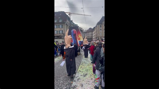 US President and middle finger hats during Fastnacht Carnival in Switzerland