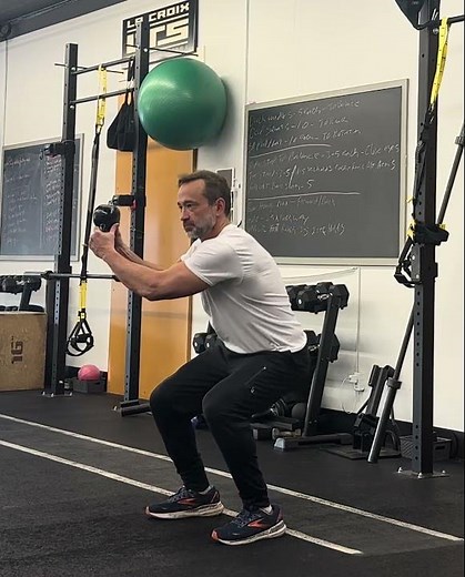 Kettlebell cross reach squat
