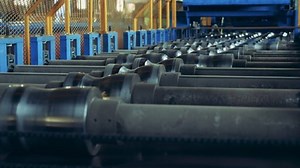 Rollers of a factory equipment are spinning at intervals