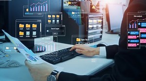 Businessman using a computer. Dialogs of software.