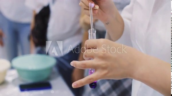 Mixing chemical reagents in a chemistry lesson at school