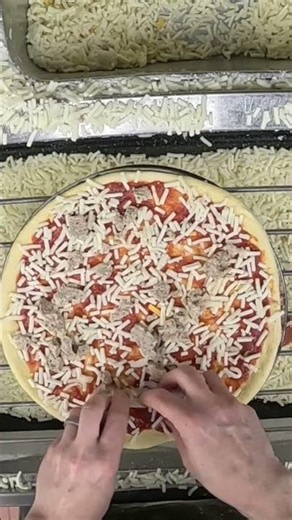Topping a sausage pizza