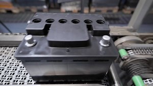 clip-1063549867-automatic-line-assembly-car-batteries-black-move