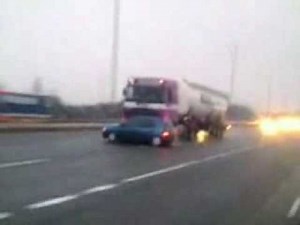 Lorry pushes car down motorway at 60mph