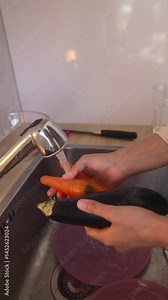 Washing Fresh Vegetables Thoroughly at the Kitchen Sink for Optimal Hygiene and Health Benefits