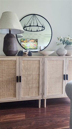 My favorite rattan cabinets ✨️ Comment TABLE to have details immediately sent to your inbox. (Check right away) ✨️Shop my bio -Amazon Storefront living room folder. ✨️On facebook link in comments Home hack! I slid these two affordable rattan cabinets together to create a longer console, I also love them for extra storage! I have all of my cozy Christmas blankets stuffed in them. • #amazonfinds #amazonmusthaves #founditonamazon #homehacks #moderndecor #christmasdecorideas #cozychristmas #livingro