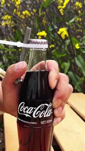 Without a bottle opener, using a bolt and strong plastic rope to open the drink cap manually today.