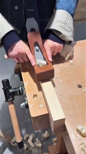 Planing a Wooden Block Manually with a Hand Tool on a Workbench