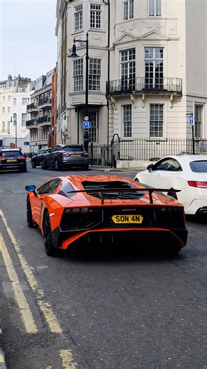 Bright orange Lamborghini seen downtown