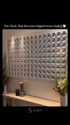 @sci.xplore on Instagram: "What looks like a wall of tiny analog clocks is actually a single, mesmerizing digital timepiece. Each pair of clock hands moves in perfect harmony, forming the current time in a digital-style display. Between transitions, the hands dance in synchronized patterns, blending precision engineering, kinetic art, and minimal design. Meet ClockClock 24 – an installation that redefines how we perceive time, turning every passing minute into a captivating performance of motion