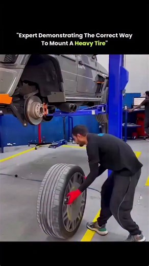 knowledge on Instagram: "Heavy tires don’t just test strength — they test technique. In this video, a new worker struggles because the tire’s weight and balance are working against him. An experienced worker steps in and uses controlled motion instead of force. By bouncing the tire at the right angle, he lets gravity and momentum align it naturally with the hub. This method reduces strain, saves time, and lowers the risk of injury. Years of hands-on experience teach workers how materials behave,