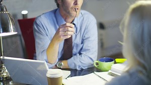 Police Detective interrogating female crime suspect in interview room