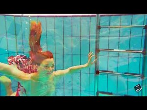 I test my gopro with nice girlfriend who makes an aquatic choreography at the pool
