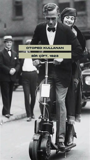 A couple riding a quadracycle in 1886 and a couple using an auto-ped in 1923.