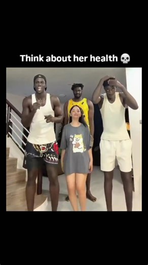 Zynox on Instagram: "The post shares a short video of a petite Asian woman energetically dancing with a group of tall, muscular Black men in a casual home setting, captioned "Think about her health 💀" to humorously highlight the physical contrast and intensity. - It has quickly amassed over 86,000 views and 92 replies within hours, with users jokingly amplifying concerns about her stamina and survival, fostering a thread of playful, exaggerated banter. - This taps into viral internet trends exa