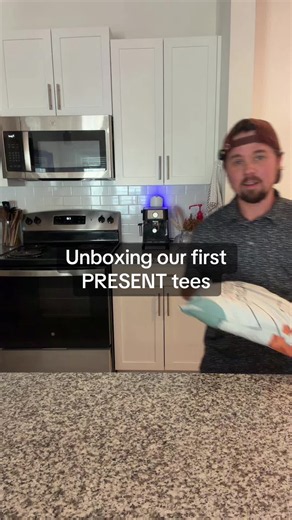our own PRESENT shirts finally showed up so we’re unboxing both designs and showing how they actually fit in real life instead of just the mockups. this is our dad merch brand, making memories and the best part are the two we’re starting with. comfort colors so they were already soft right out of the bag #printondemand #unboxing #smallbusinessowner #merchdrop #tshirtdesign