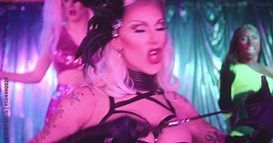 Group of Drag Queens Performing Show on Stage