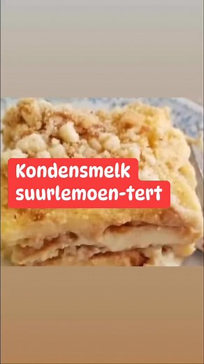 Hierdie Kondensmelk Suurlemoen Tert is so maklik dat selfs beginners dit kan maak! 🍋🍰 Met net 'n paar bestanddele en 'n bietjie geduld, kan jy 'n heerlike nagereg geniet. 🎉 Kondensmelk Suurlemoen Tert Resep 🍋 Bestanddele: • 3 k melk 🥛 • 1 E suiker 🍬 • 2 E vlapoeier 🥣 • 1 blikkie kondensmelk 🍯 • kwart k suurlemoensap 🍋 • Tenniskoekies 🎾 Instruksies: 1. Maak dik vla van 3 k melk, 1 E suiker en 2 E vlapoeier. 🥣 2. Koel af. ❄️ 3. Meng 1 blikkie kondensmelk met kwart k suurlemoensap, bietj