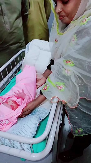 Newborn Baby in Floral Blanket at Hospital