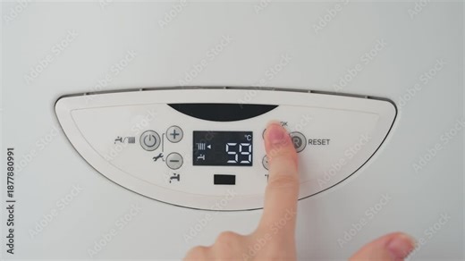 silhouette person turning on boiler heating appliance, human hand finger pressing button control dial of digital thermostat display to increase operating temperature heating system. utility bills 4k