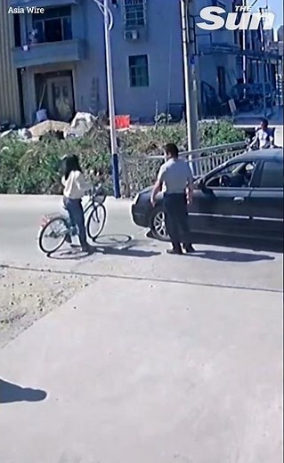 Woman cyclist hit by car before getting up unscathed #Shorts