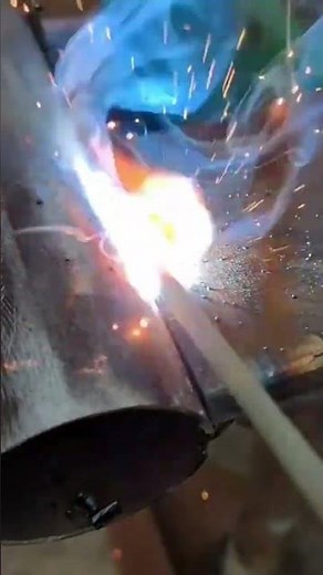 Industrial Arc Welding Process Joining Metal Pipe Sections With Sparks