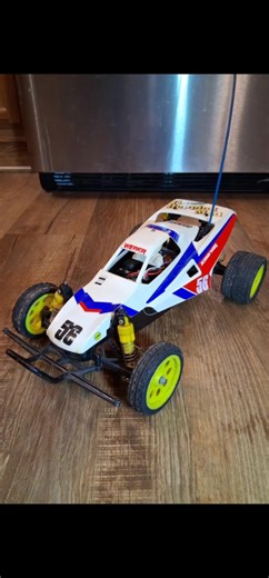 Vintage RC buggy. Tamiya Grasshopper Super G. Still running vintage electronics. Factory oil shocks and neon wheels